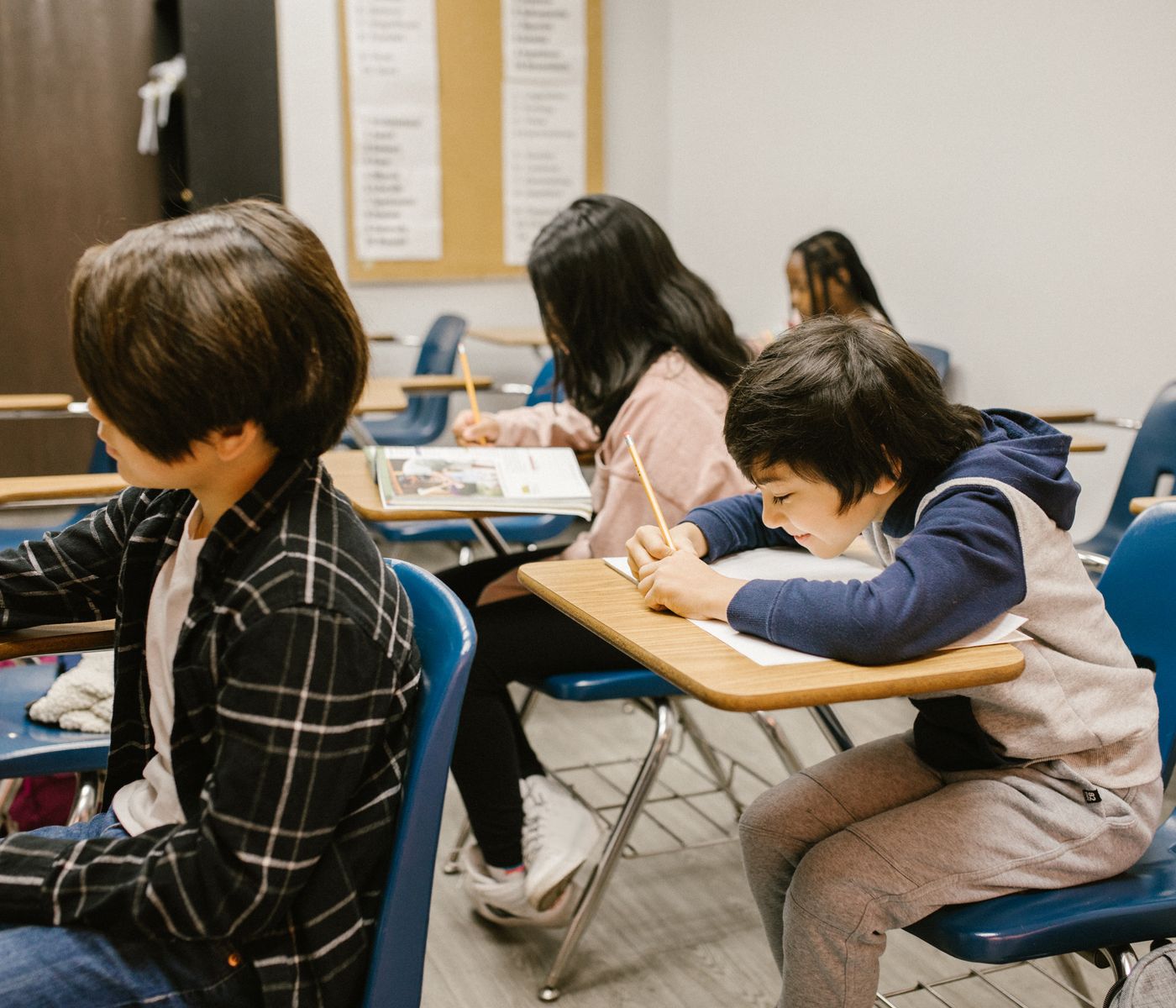 Children working at their desks in a classroom
